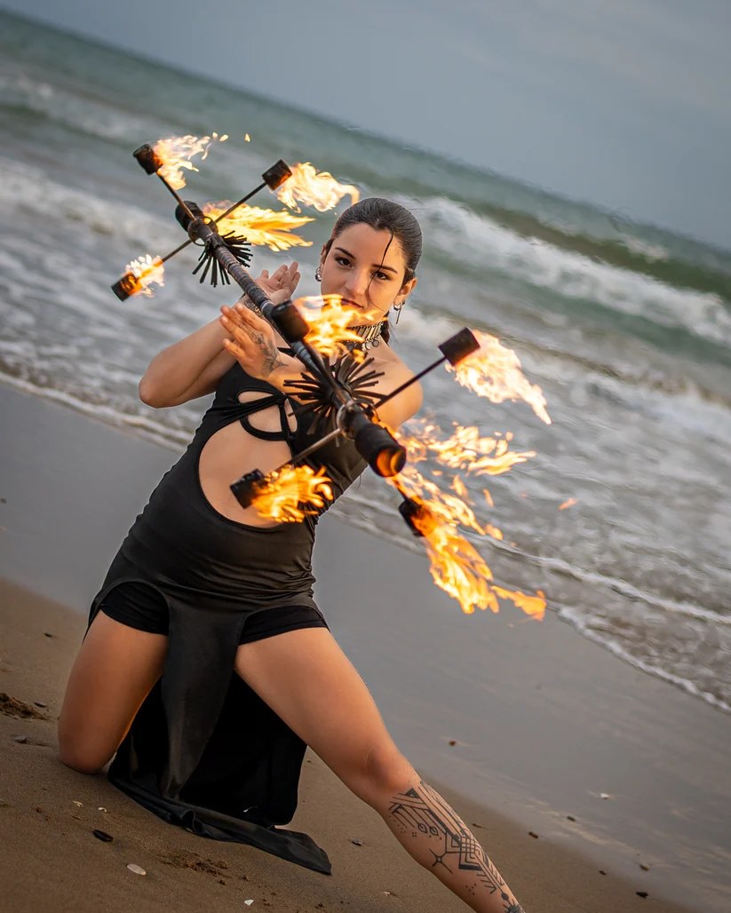 Spinsterz performers with fire hoops, an LED hoop and fire fans