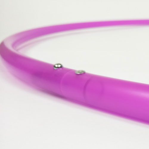 Furious Fuchsia UV Fuchsia hula hoop on a white background. Handmade in Boulder Colorado.
