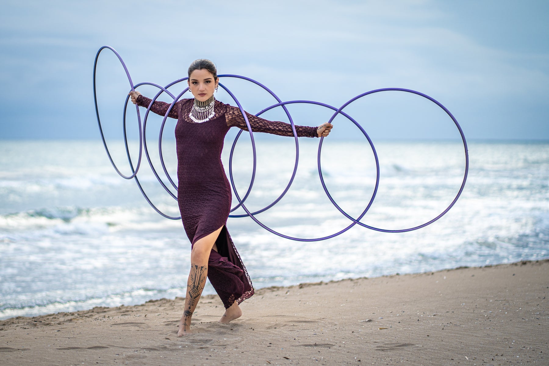 The Spinsterz hoop artist performing on the beach