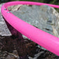 Close-up of a starberry glitter pink hula hoop on a textured surface